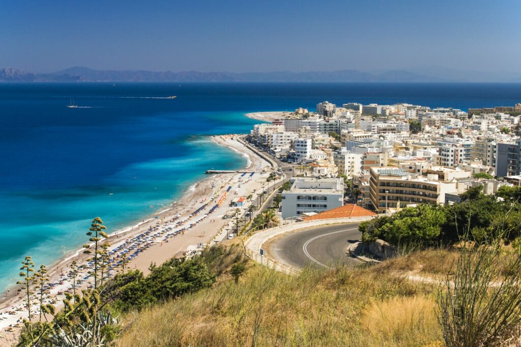 Aerial View of City Buildings Near Sea in Greek Island