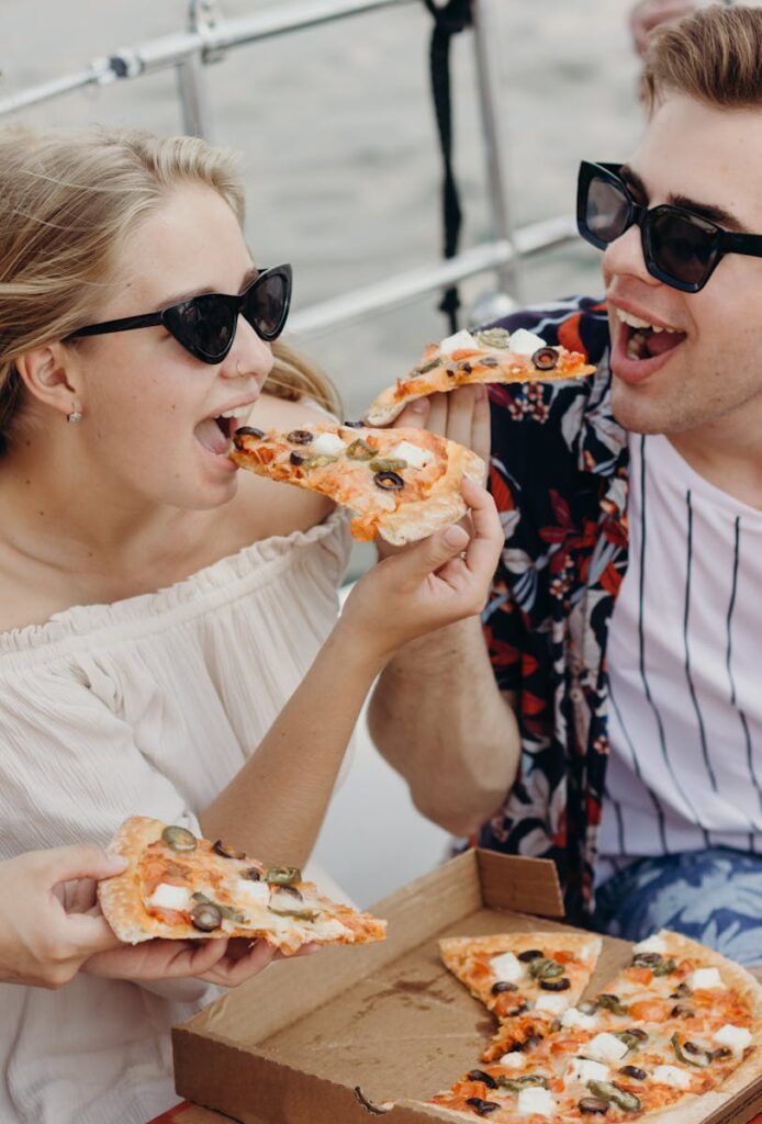 Young Couple eating Pizza