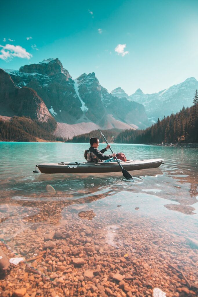 Person Riding on Gray Kayak