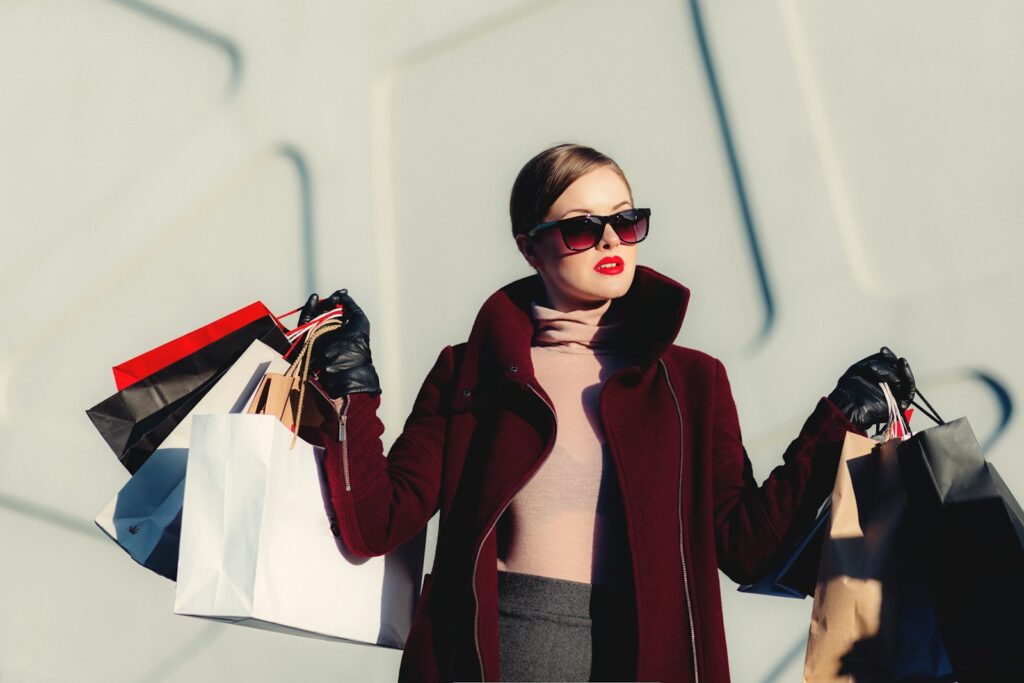 photo of woman holding white and black paper bags -What to do on an Alaskan Cruise