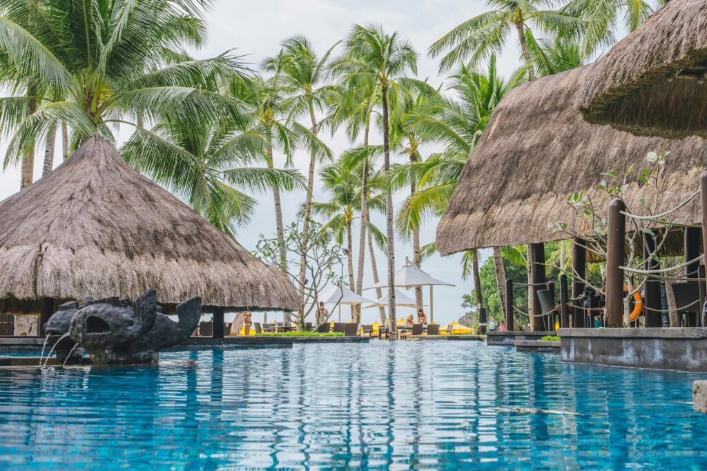 a pool with a waterfall in the middle of it