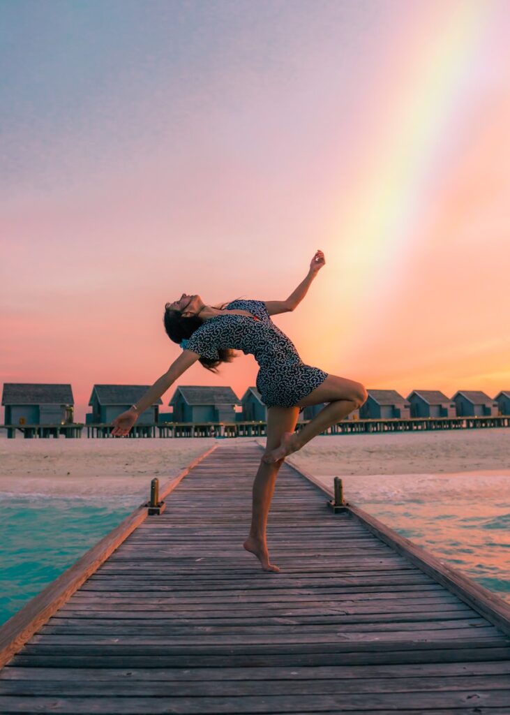 woman dancing on dock - things to do on a cruise