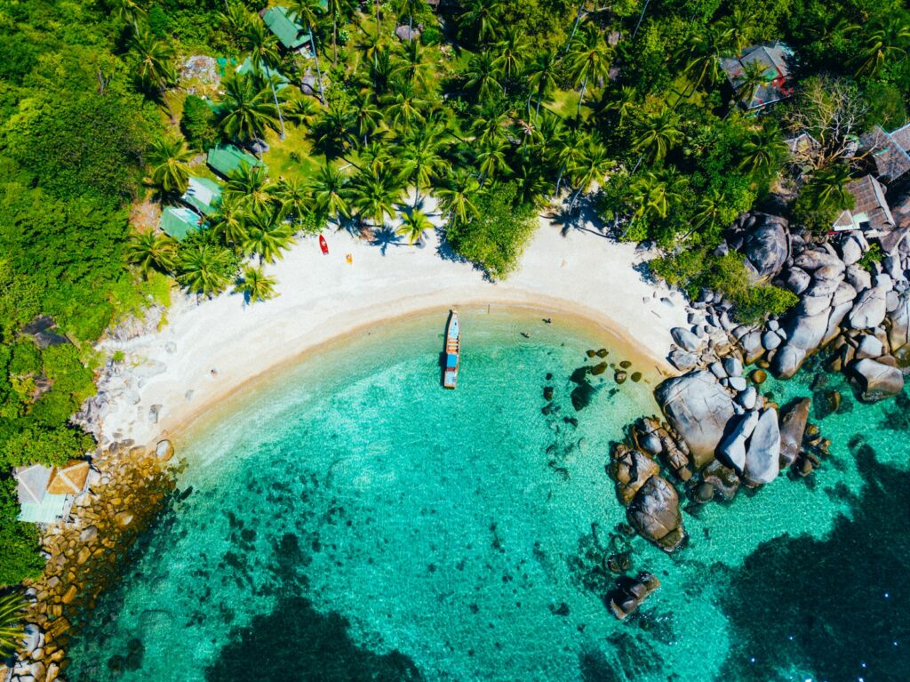 white boat dock on seashore near green trees during daytime - Thailand - island hopping for couples
