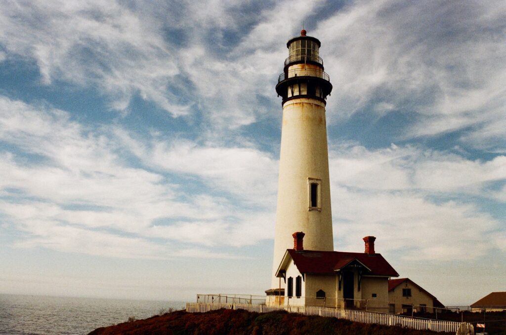 lighthouse near body of water - things to do in Aruba on a cruise