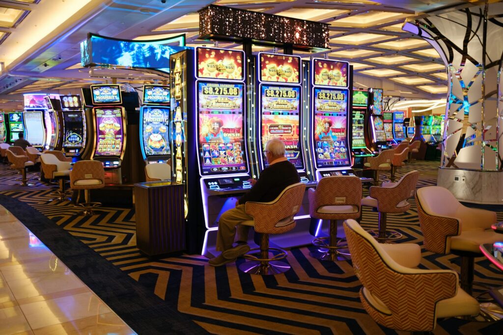 a casino room filled with lots of slot machines - celebrity cruise review